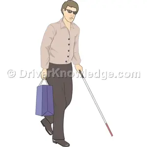 pedestrian using a white cane